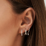 14k Rose Diamond Huggies with a Dangling Baguette Diamond Ferkos Fine Jewelry
