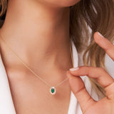 14k Oval Shape Emerald with Baguette Halo Setting Necklace Ferkos Fine Jewelry