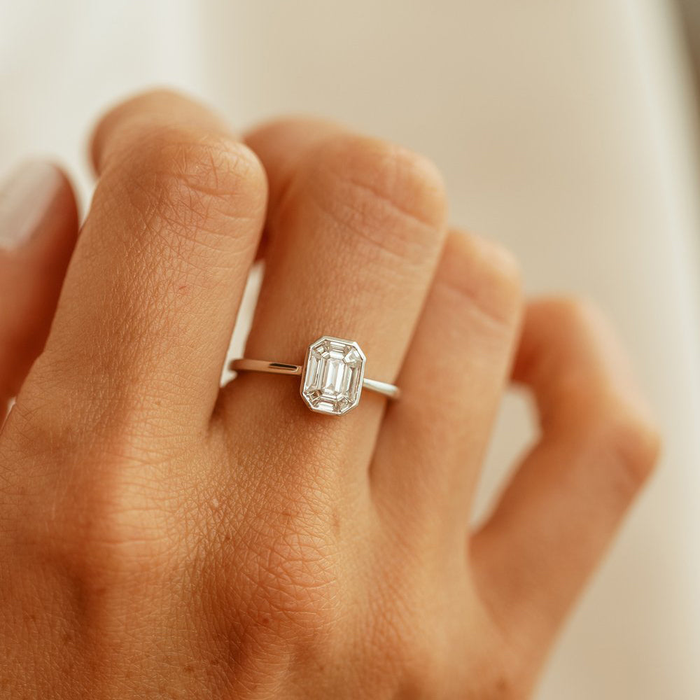 emerald cut engagement rings on finger
