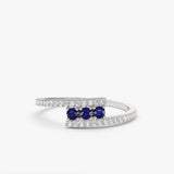 14k Cross Over Diamond Ring with Round Blue Sapphires Ferkos Fine Jewelry