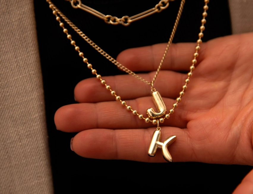 layered gold chain necklaces with j and k letter charms