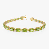 14K Gold Oval Shaped Peridot Tennis Bracelet 13.70 ctw 14k Gold Ferkos Fine Jewelry
