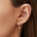 14k Rose Diamond Huggies with a Dangling Baguette Diamond Ferkos Fine Jewelry