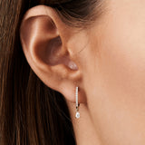 14k Rose Diamond Huggies with a Dangling Pear Shape Diamond Ferkos Fine Jewelry