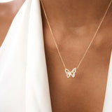 14K Gold Round Diamond Butterfly Necklace with Fluted Texture - 0.18 Ctw, worn on model