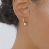 14k Diamond Huggie Earrings with Dangling Illusion Set Baguette Diamonds